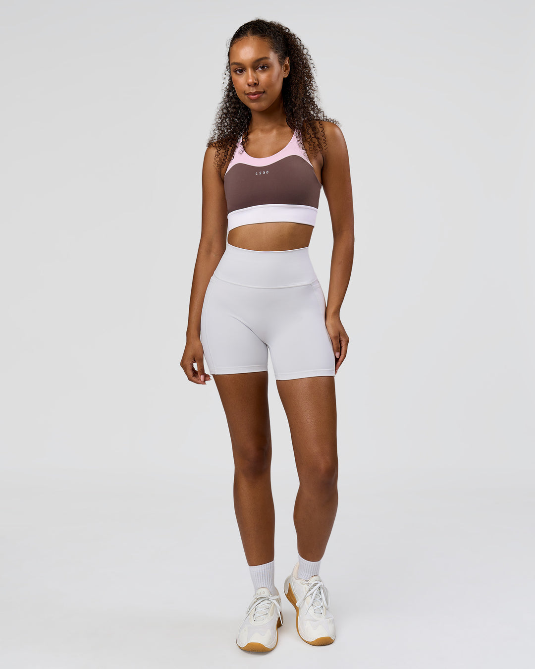 Woman wearing Fusion V-Contour Ultra High-Rise 6" Short Pockets - White | Model:Jordan | Size:S - view 8