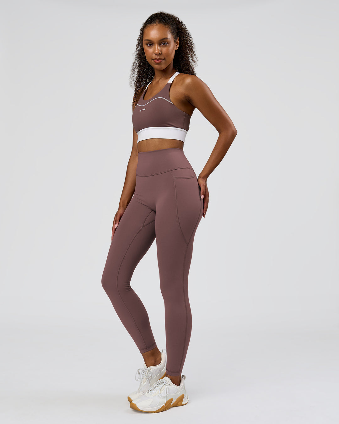 Woman wearing Fusion V-Contour Ultra High-Rise Full Length Legging Pockets - Cocoa Powder | Model:Jordan | Size:S - view 4