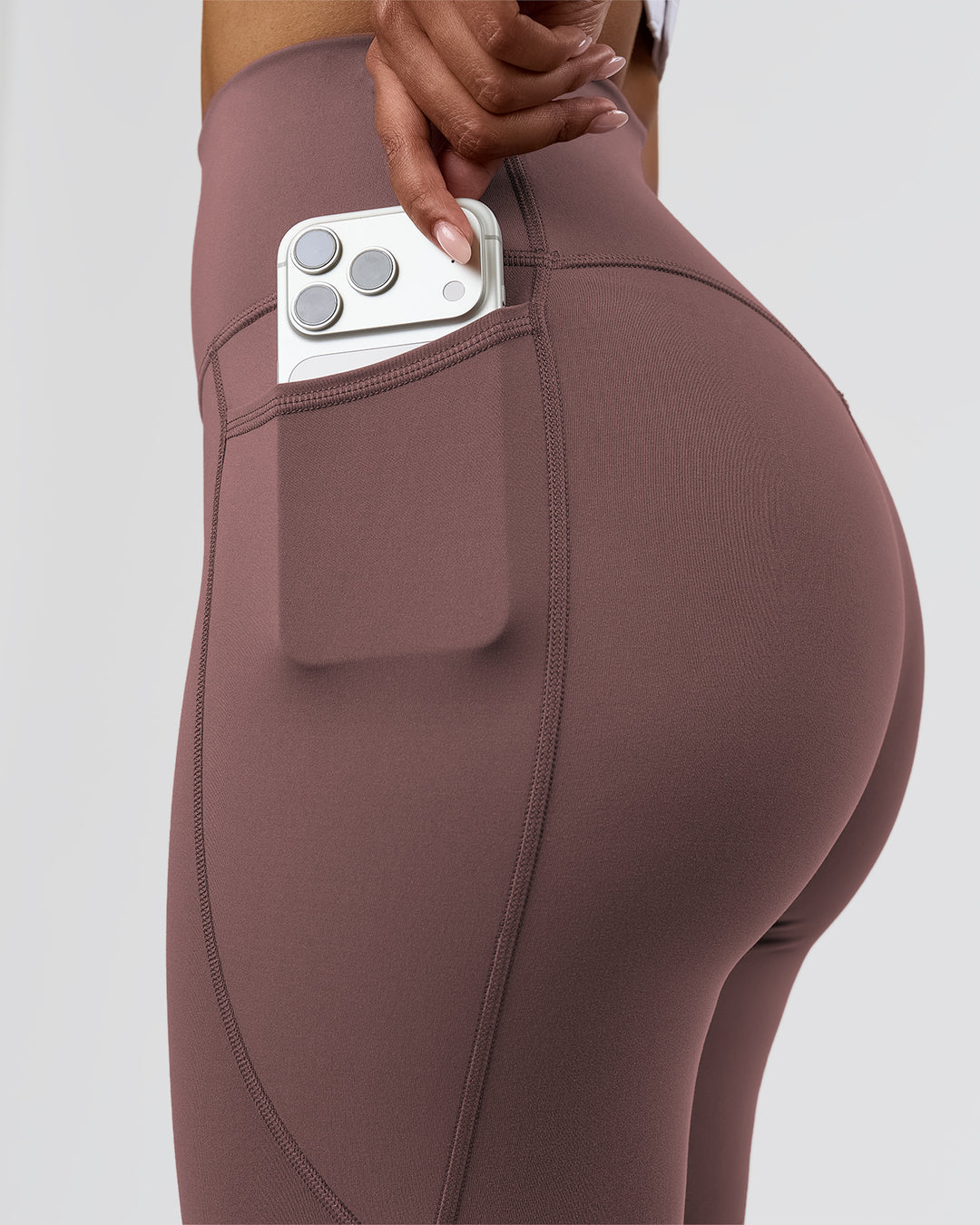 Woman wearing Fusion V-Contour Ultra High-Rise Full Length Legging Pockets - Cocoa Powder | Model:Jordan | Size:S - view 8
