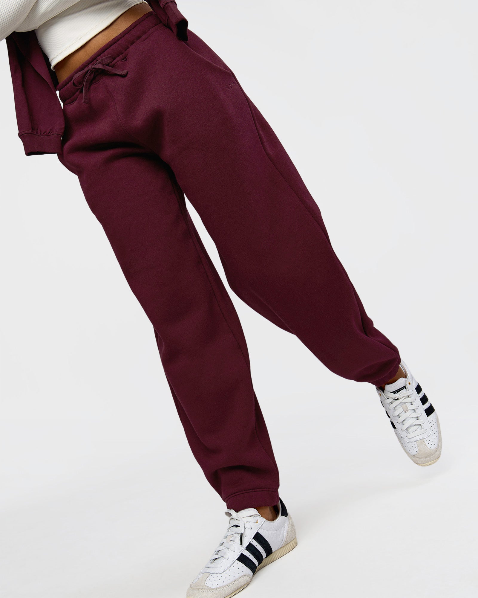 Woman wearing Go-To Oversized Track Pant - Cherry Lacquer | Model:Jordan | Size:S