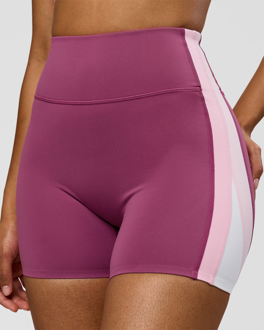 Woman wearing Revitalise Ultra High-Rise 4" Short - Boysenberry - Pink Rose | Model:Jordan | Size:S - view 1