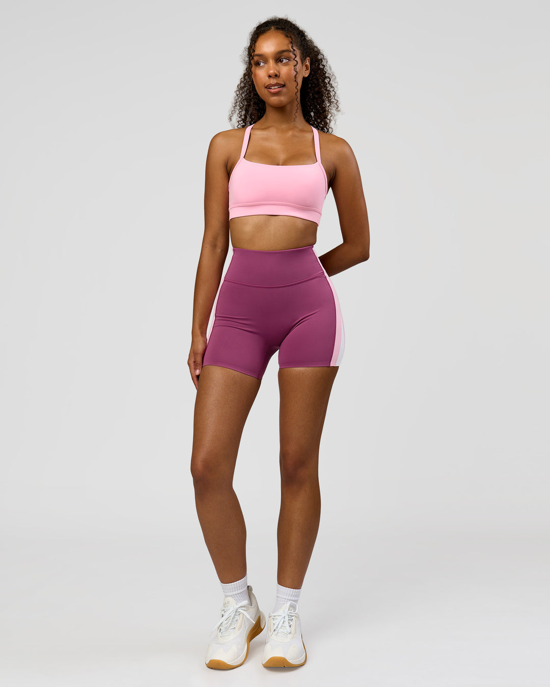 Woman wearing Revitalise Ultra High-Rise 4" Short - Boysenberry - Pink Rose | Model:Jordan | Size:S - view 6