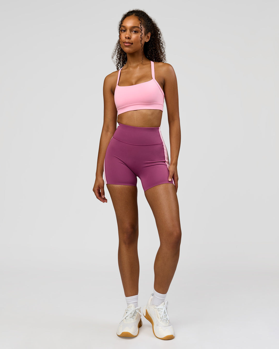 Woman wearing Revitalise Ultra High-Rise 4" Short - Boysenberry - Pink Rose | Model:Jordan | Size:S - view 7