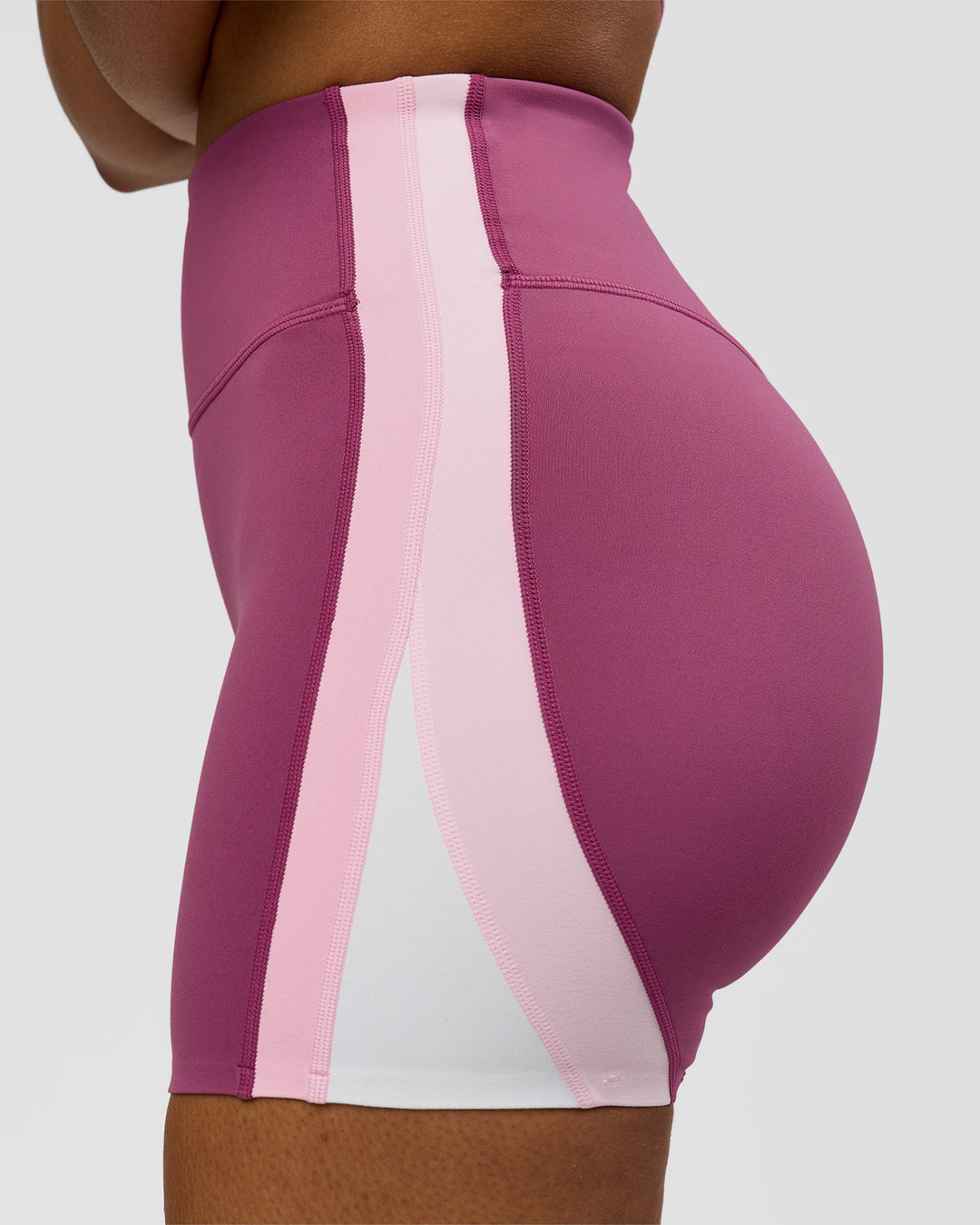 Woman wearing Revitalise Ultra High-Rise 4" Short - Boysenberry - Pink Rose | Model:Jordan | Size:S - view 9