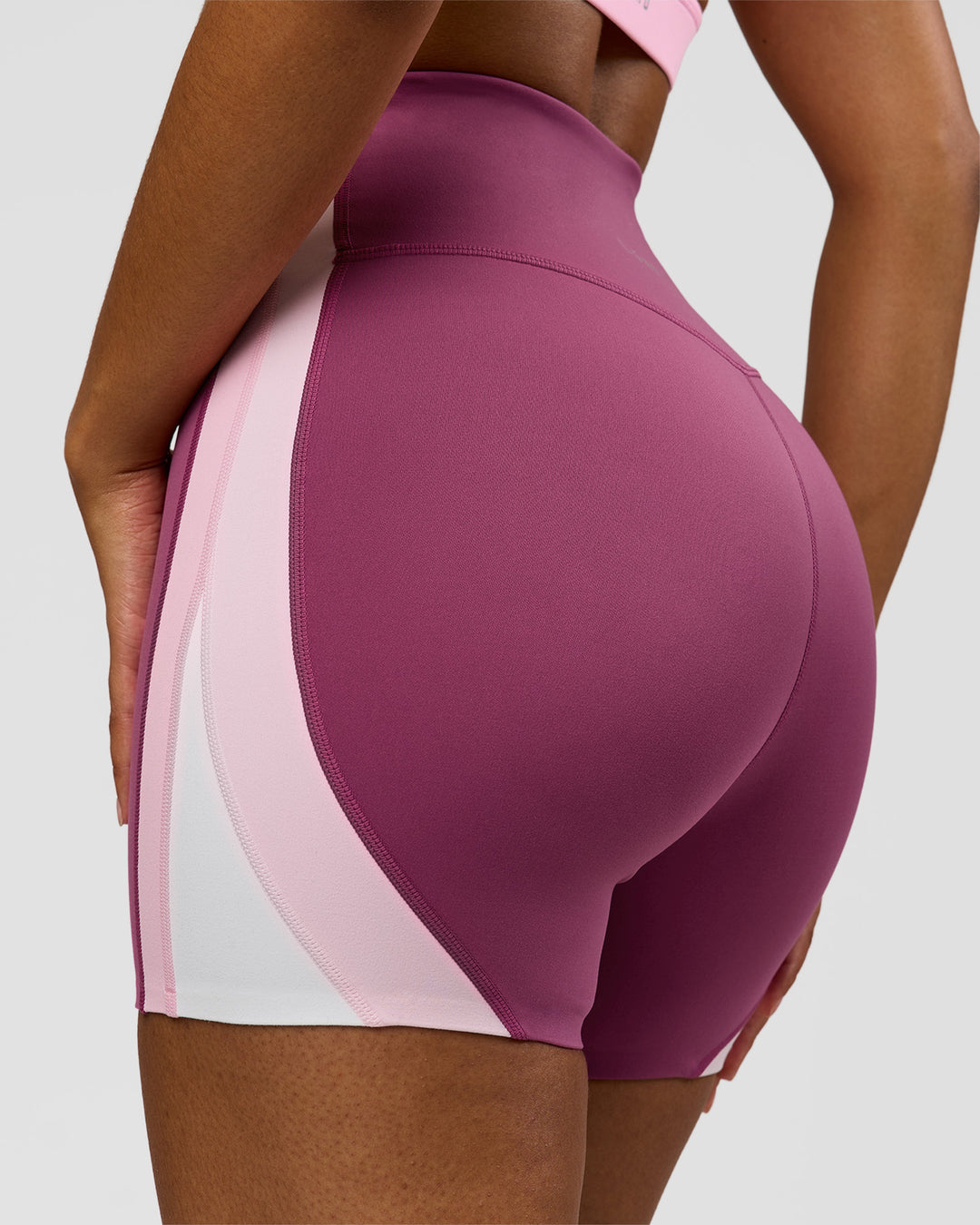 Woman wearing Revitalise Ultra High-Rise 4" Short - Boysenberry - Pink Rose | Model:Jordan | Size:S - view 13