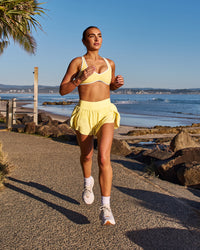 Woman wearing Pacer 3" Run Short - Lemon | Model:Libby | Size:S | Thumbnail Index: 11