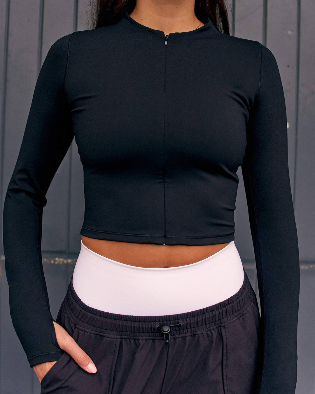 Woman wearing Sculpt Full Zip Long Sleeve Top - Black | Model:Remy | Size:S - view 2