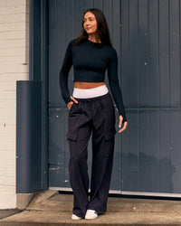 Woman wearing Sculpt Full Zip Long Sleeve Top - Black | Model:Remy | Size:S | Thumbnail Index: 4