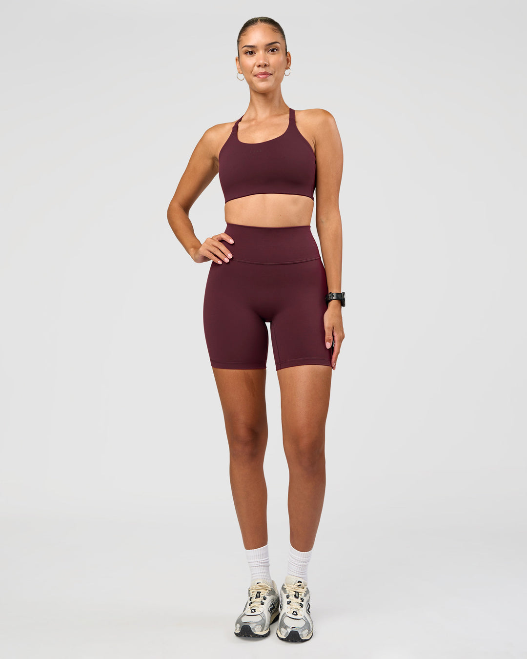 Woman wearing Twist Sports Bra D/DD/E - Cherry Lacquer | Model:Rhiley | Size:S - view 2