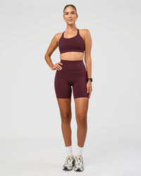 Woman wearing Twist Sports Bra D/DD/E - Cherry Lacquer | Model:Rhiley | Size:S | Thumbnail Index: 1