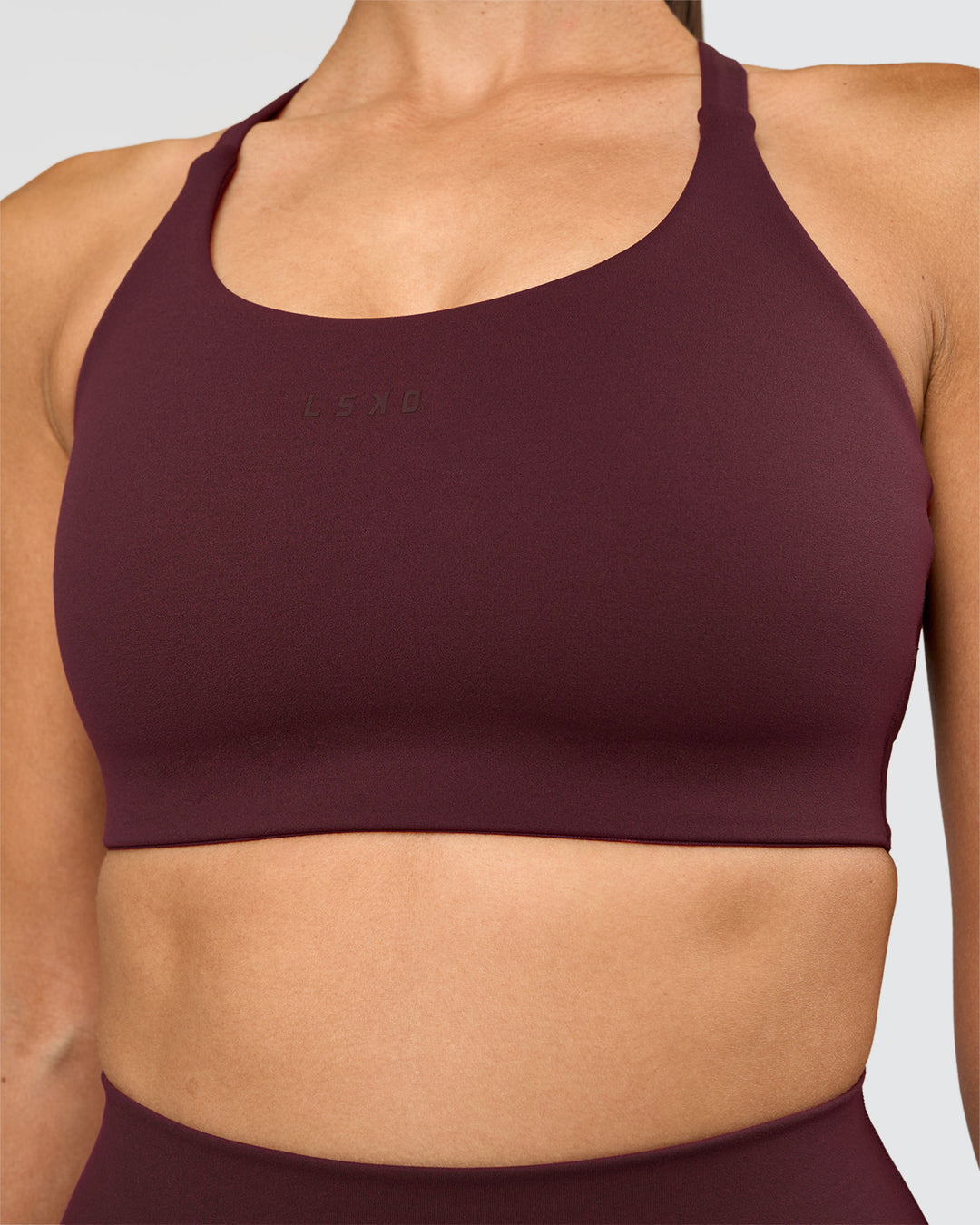 Woman wearing Twist Sports Bra D/DD/E - Cherry Lacquer | Model:Rhiley | Size:S - view 4