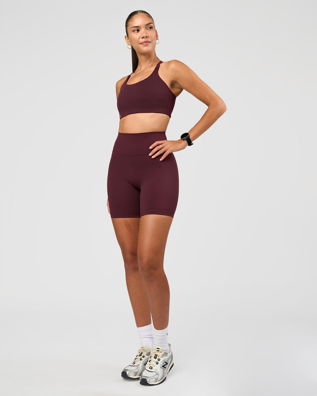 Woman wearing Twist Sports Bra D/DD/E - Cherry Lacquer | Model:Rhiley | Size:S - view 5