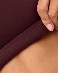 Woman wearing Twist Sports Bra D/DD/E - Cherry Lacquer | Model:Rhiley | Size:S | Thumbnail Index: 6