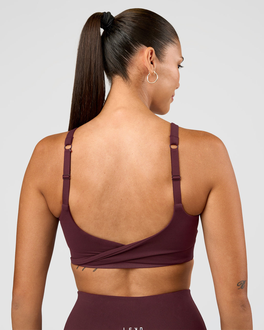 Woman wearing Twist Sports Bra D/DD/E - Cherry Lacquer | Model:Rhiley | Size:S - view 8