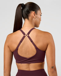 Woman wearing Twist Sports Bra D/DD/E - Cherry Lacquer | Model:Rhiley | Size:S | Thumbnail Index: 0