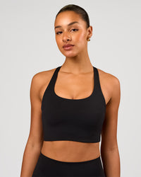 Woman wearing Flow Long Line Sports Bra - Black | Model:Rosie | Size:S | Thumbnail Index: 0