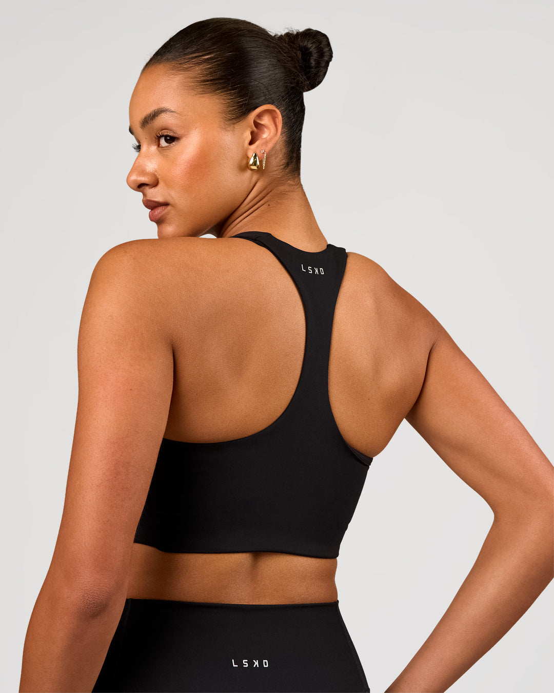 Woman wearing Flow Long Line Sports Bra - Black | Model:Rosie | Size:S - view 2