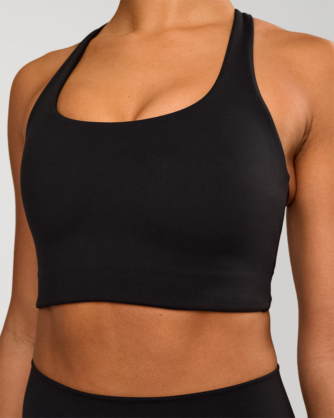 Woman wearing Flow Long Line Sports Bra - Black | Model:Rosie | Size:S - view 3