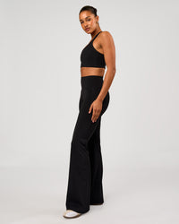 Woman wearing Flow Long Line Sports Bra - Black | Model:Rosie | Size:S | Thumbnail Index: 3