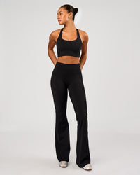 Woman wearing Flow Long Line Sports Bra - Black | Model:Rosie | Size:S | Thumbnail Index: 4