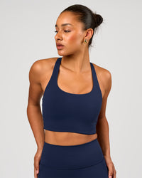 Woman wearing Flow Long Line Sports Bra - Future Navy | Model:Rosie | Size:S | Thumbnail Index: 0