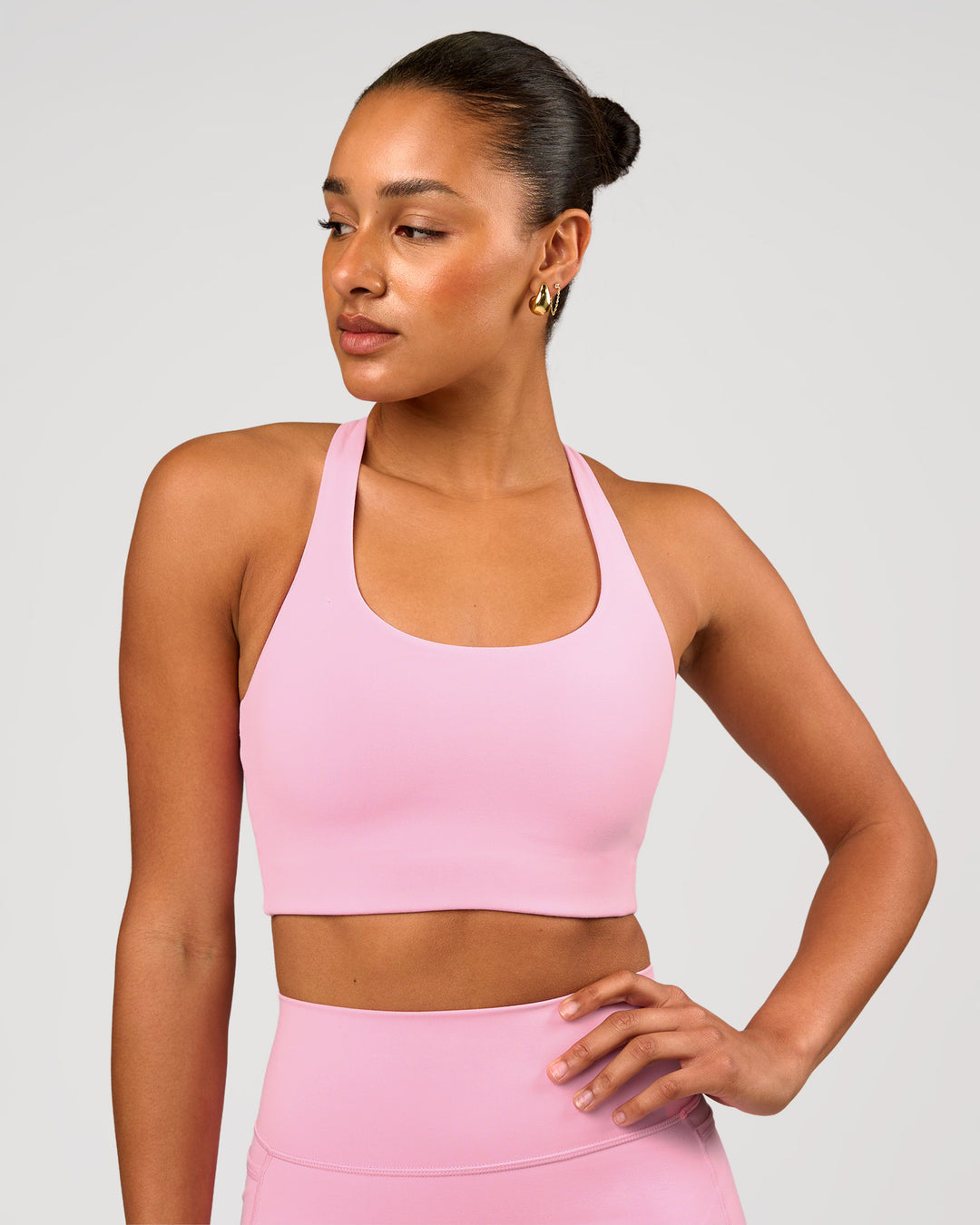 Woman wearing Flow Long Line Sports Bra - Pink Rose | Model:Rosie | Size:S - view 1