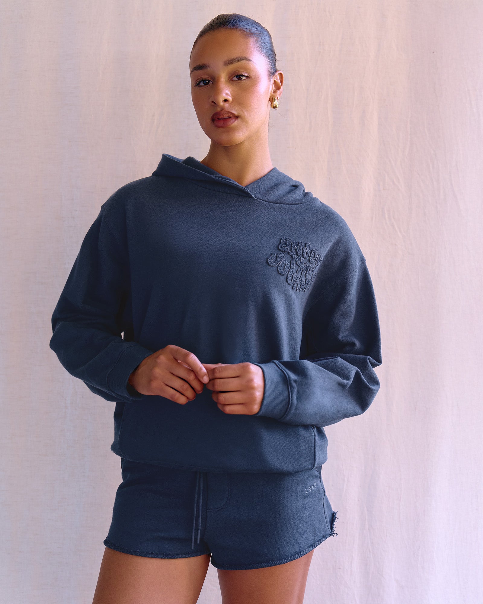 Woman wearing MVP Elite French Terry Hoodie - Future Navy | Model:Rosie | Size:S