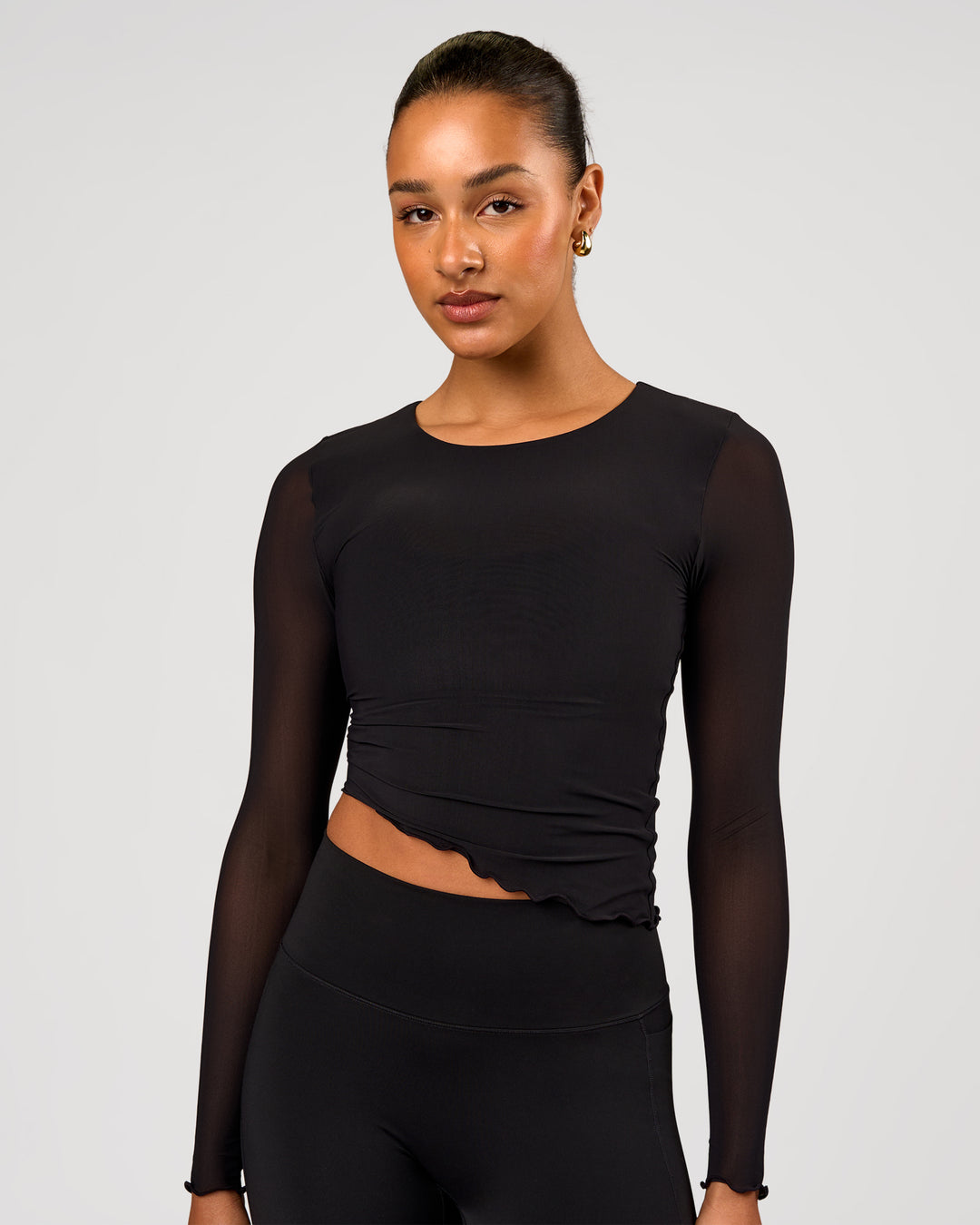 Woman wearing Studio Mesh Asymmetric Long Sleeve - Black | Model:Rosie | Size:S - view 2