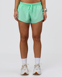 Woman wearing Accelerate 3" Mid-Rise Running Short - Jelly Mint | Model:Summer | Size:S | Thumbnail Index: 2