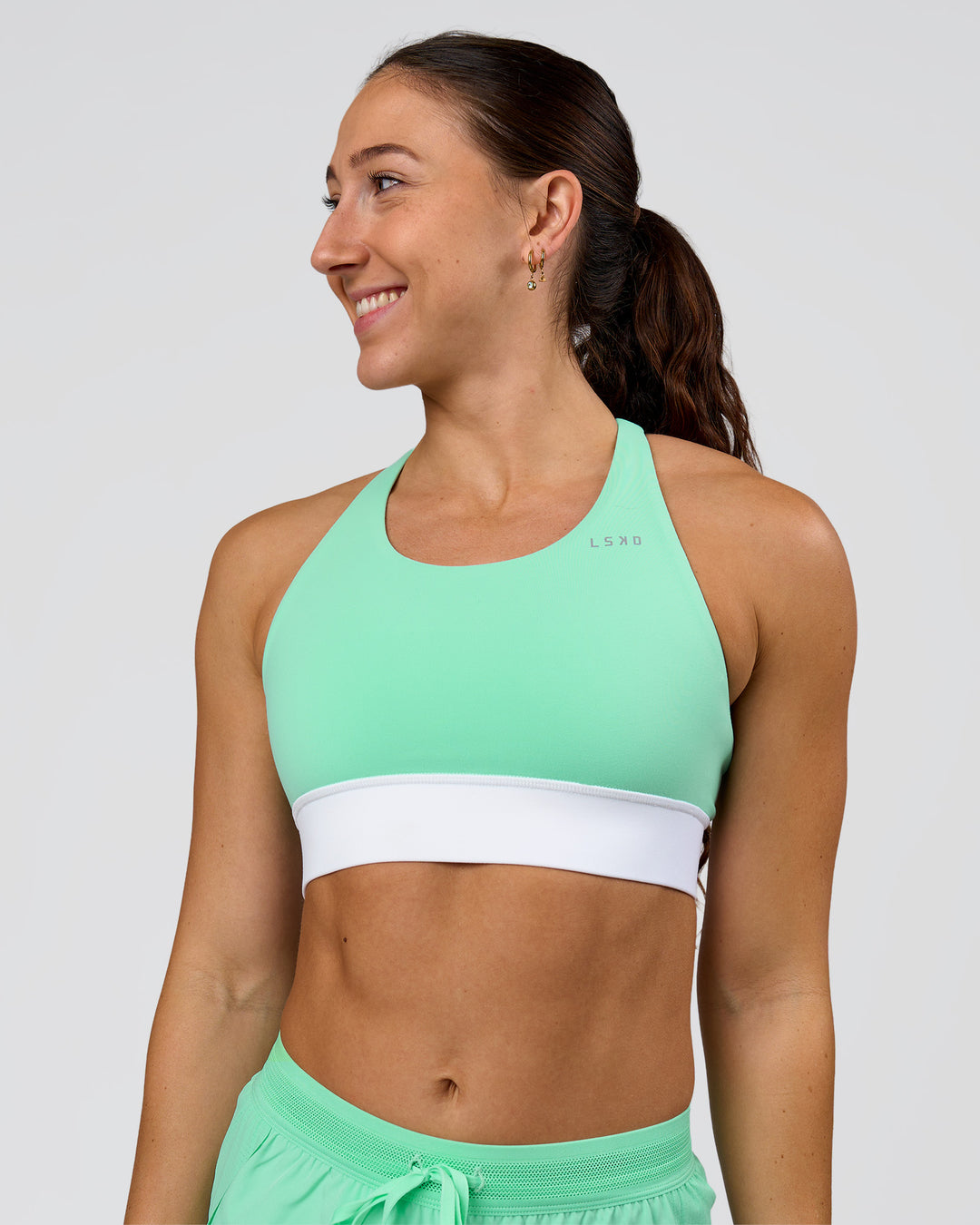 Woman wearing Accelerate Sports Bra - Jelly Mint-White | Model:Summer | Size:S - view 1