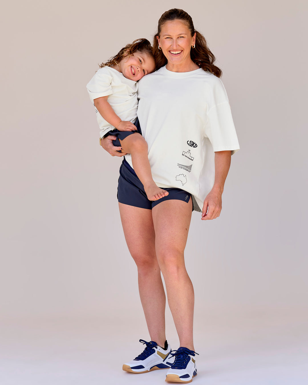 Woman wearing Greatest of All Time Heavyweight FLXCotton Oversized Tee - Off White Washed-Scarlet | Model:Tia | Size:S - view 8