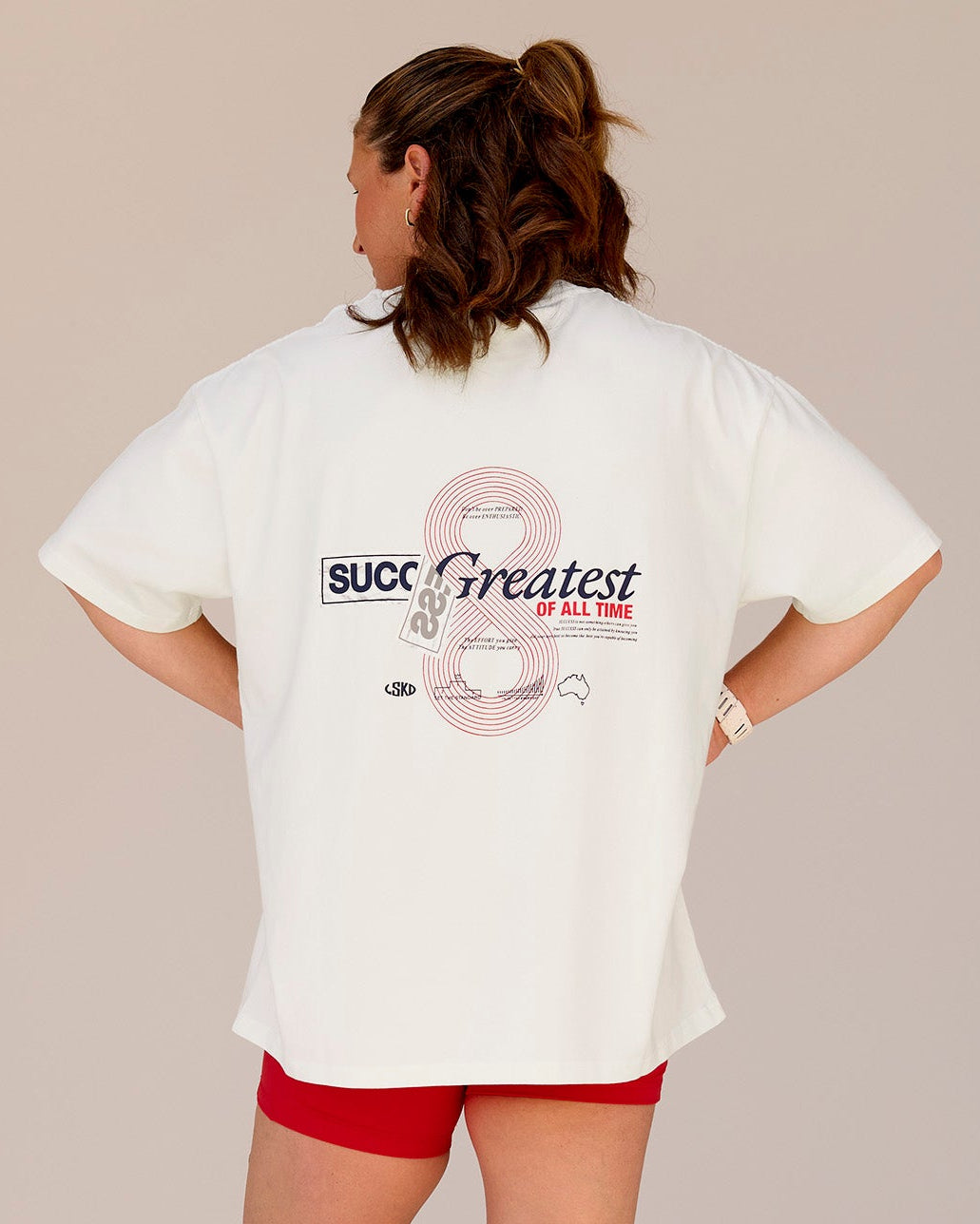 Woman wearing Greatest of All Time Heavyweight FLXCotton Oversized Tee - Off White Washed-Scarlet | Model:Tia | Size:S - view 6