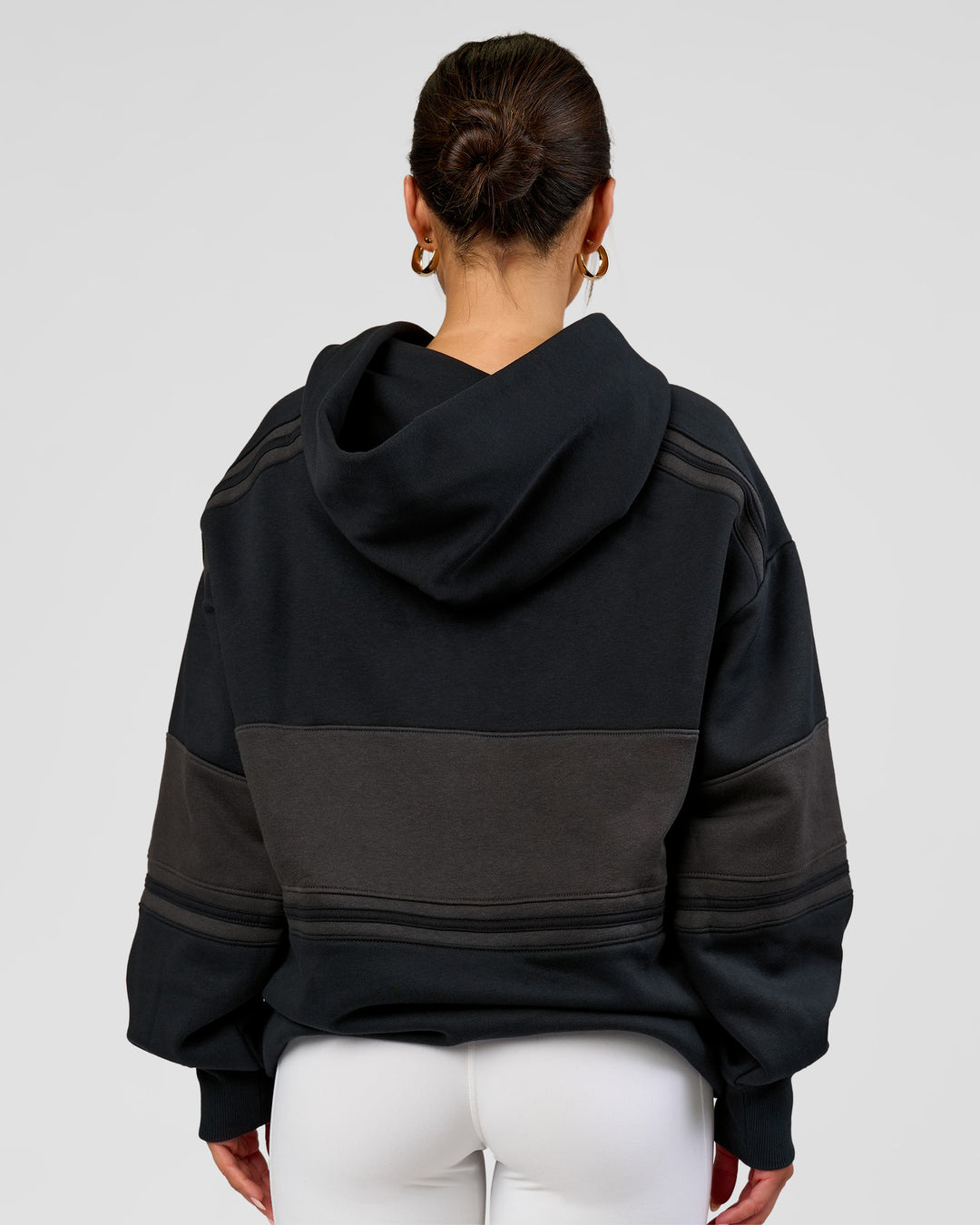 Woman wearing A-Team Oversized Hoodie - Caviar-Onyx | Model:Bianca | Size:XS - view 7