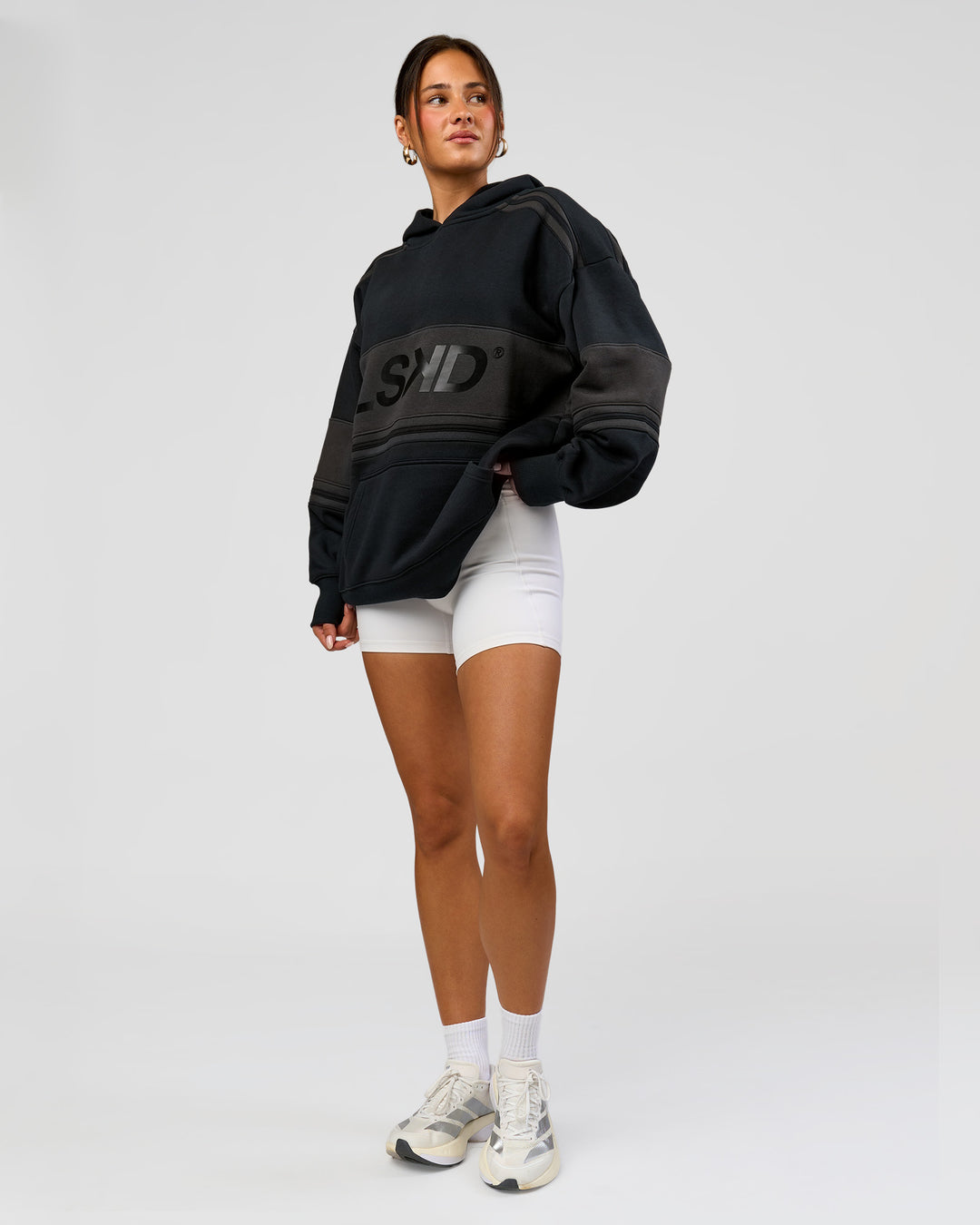 Woman wearing A-Team Oversized Hoodie - Caviar-Onyx | Model:Bianca | Size:XS - view 15