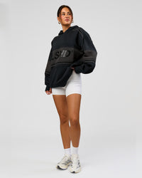 Woman wearing A-Team Oversized Hoodie - Caviar-Onyx | Model:Bianca | Size:XS | Thumbnail Index: 14