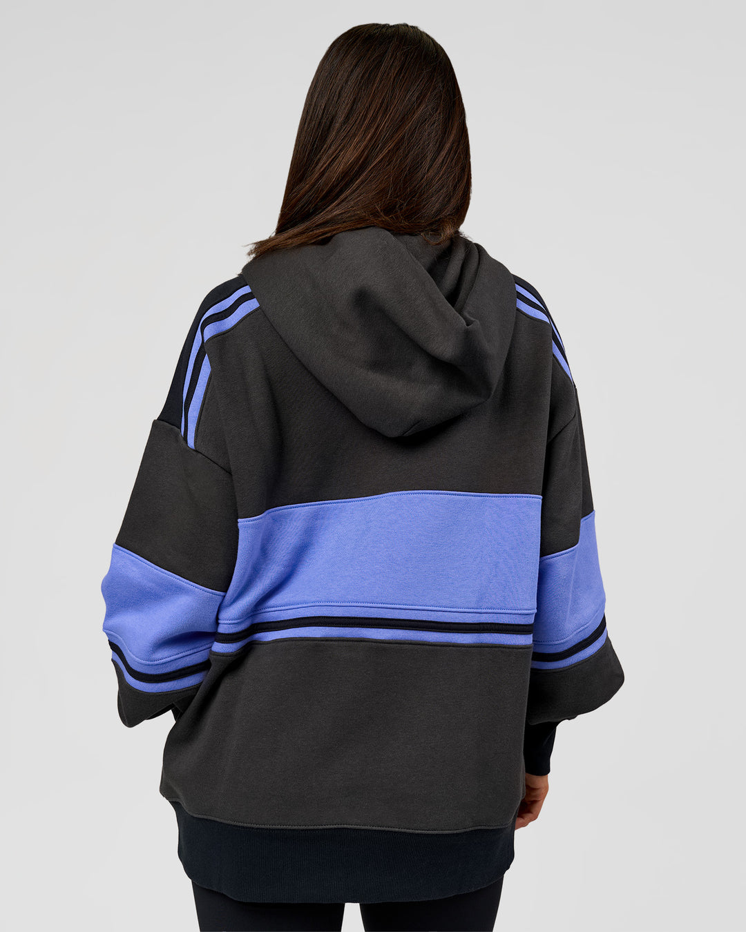Woman wearing A-Team Oversized Hoodie - Onyx-Bluebell | Model:Bianca | Size:XS - view 6