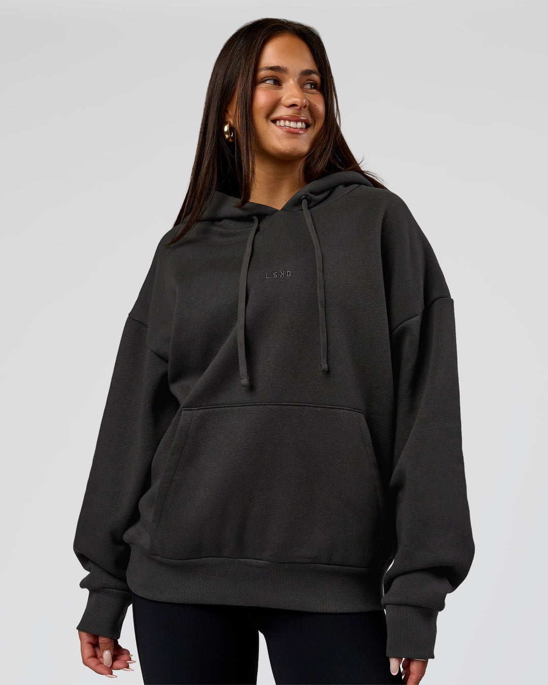 Woman wearing Base Oversized DC Hoodie - Onyx | Model:Bianca | Size:XS - view 3