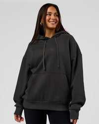 Woman wearing Base Oversized DC Hoodie - Onyx | Model:Bianca | Size:XS | Thumbnail Index: 2