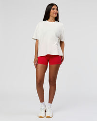 Woman wearing Greatest of All Time Heavyweight FLXCotton Boxed Tee - Off White Washed | Model:Rhiley | Size:XS | Thumbnail Index: 14