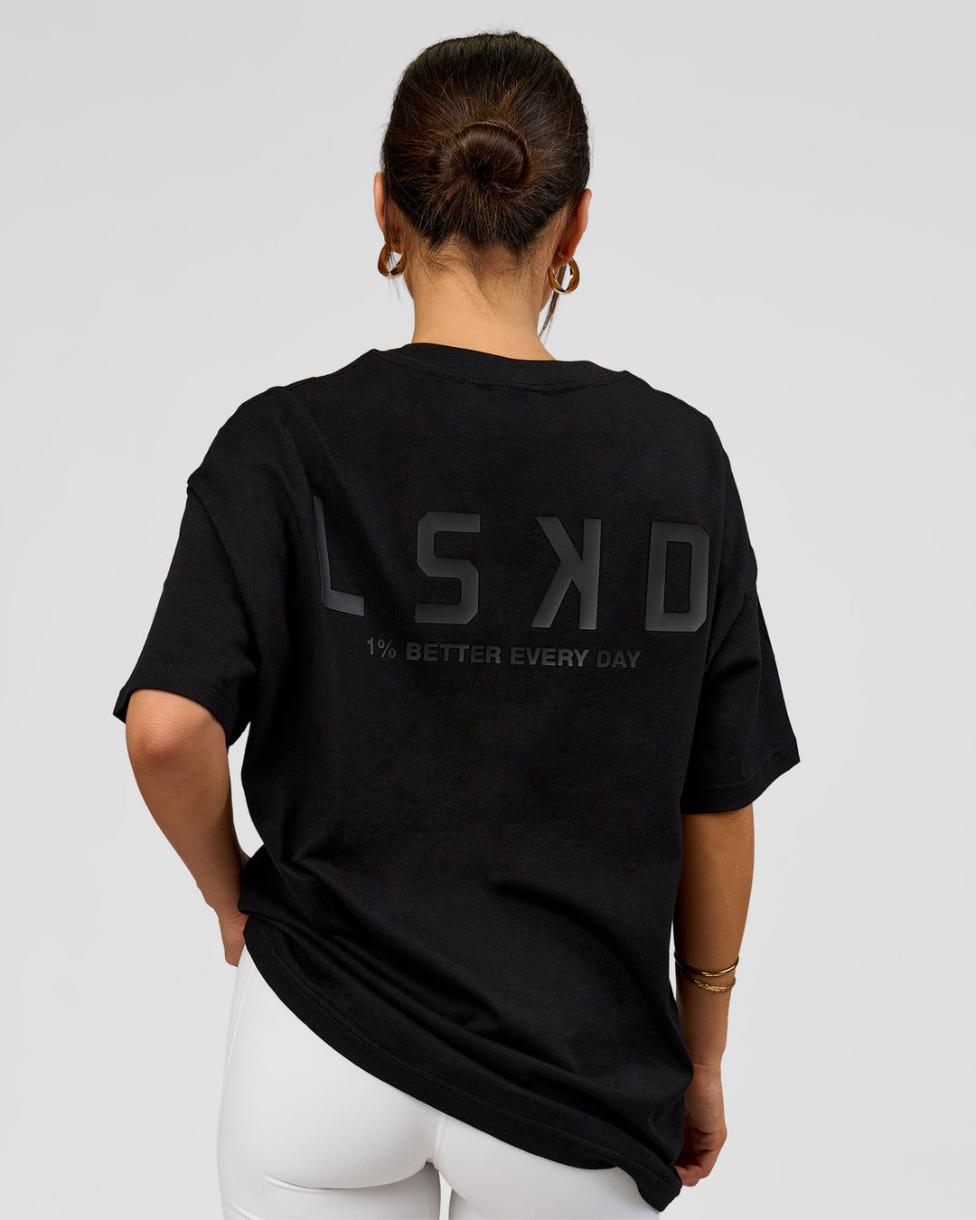Woman wearing Tonal Legacy Heavyweight Oversized Tee - Black-Black | Model:Bianca | Size:XS - view 3