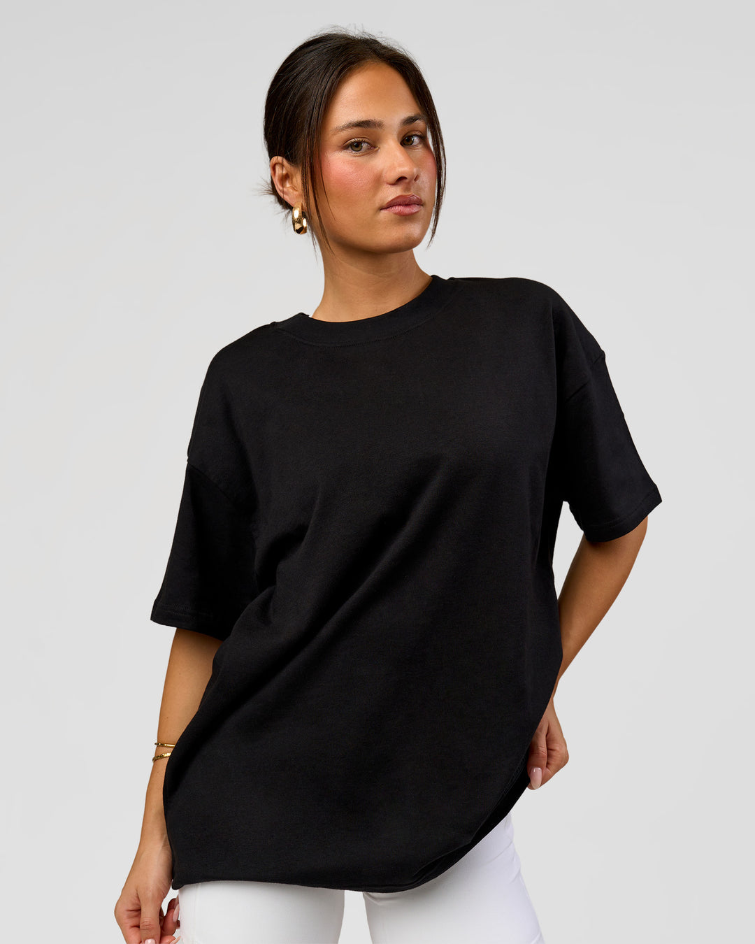 Woman wearing Tonal Legacy Heavyweight Oversized Tee - Black-Black | Model:Bianca | Size:XS - view 6