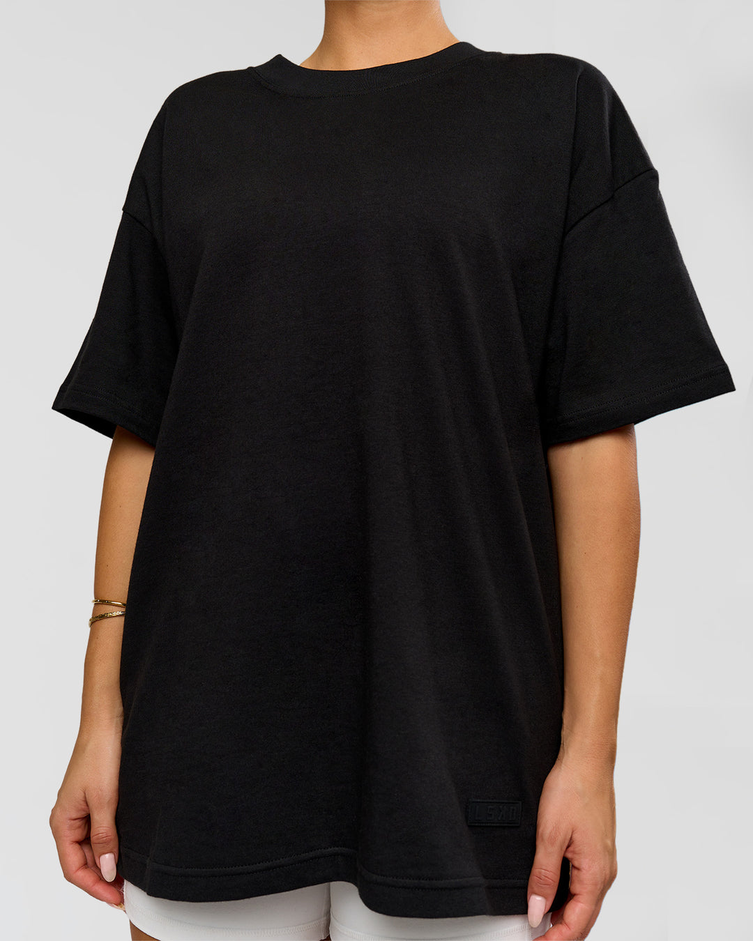 Woman wearing Tonal Legacy Heavyweight Oversized Tee - Black-Black | Model:Bianca | Size:XS - view 9