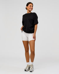 Woman wearing Tonal Legacy Heavyweight Oversized Tee - Black-Black | Model:Bianca | Size:XS | Thumbnail Index: 14