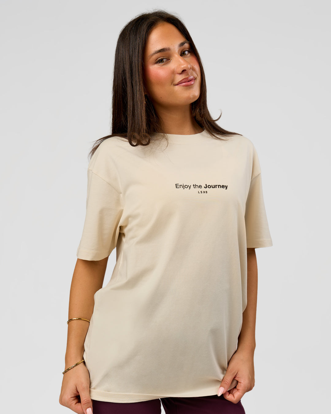 Woman wearing VS1 Enjoy The Journey FLXCotton Oversize Tee - Vanilla Bean | Model:Bianca | Size:XS - view 10