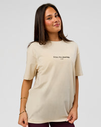 Woman wearing VS1 Enjoy The Journey FLXCotton Oversize Tee - Vanilla Bean | Model:Bianca | Size:XS | Thumbnail Index: 9