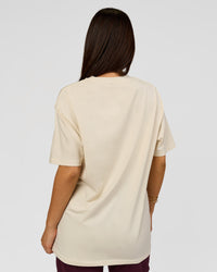 Woman wearing VS1 Enjoy The Journey FLXCotton Oversize Tee - Vanilla Bean | Model:Bianca | Size:XS | Thumbnail Index: 12