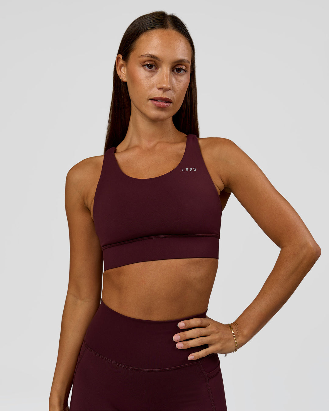 Woman wearing Accelerate Sports Bra - Cherry Lacquer | Model:Brylee | Size:XS - view 2