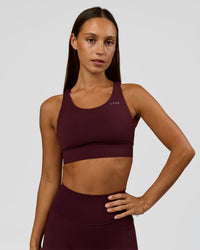 Woman wearing Accelerate Sports Bra - Cherry Lacquer | Model:Brylee | Size:XS | Thumbnail Index: 1