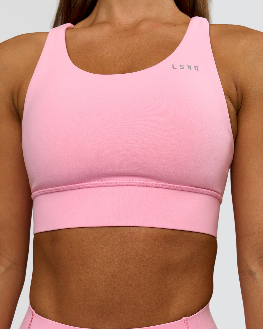 Woman wearing Accelerate Sports Bra - Pink Rose | Model:Brylee | Size:XS - view 3