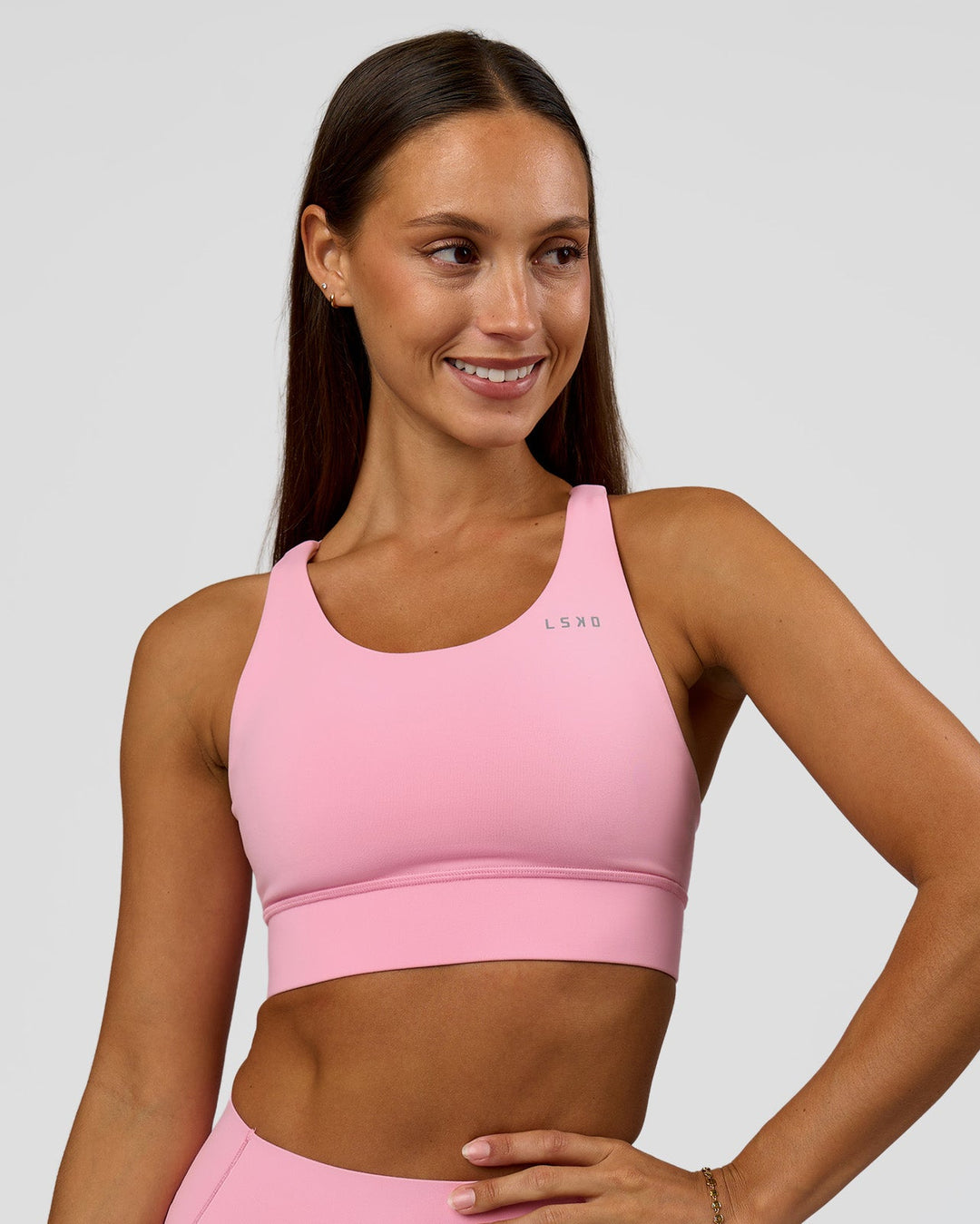 Woman wearing Accelerate Sports Bra - Pink Rose | Model:Brylee | Size:XS - view 1
